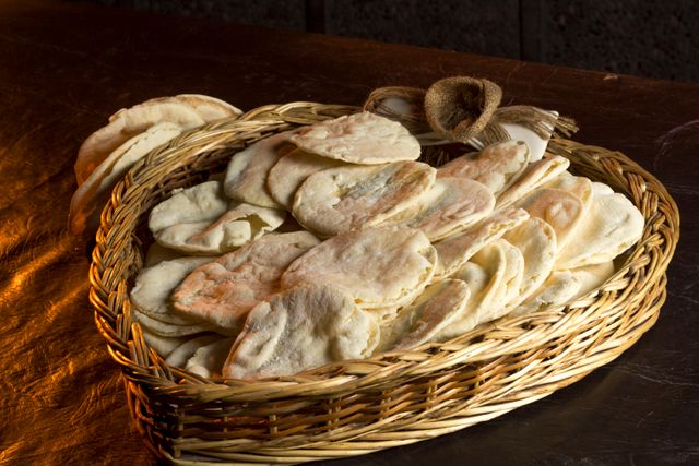 Kuboos breads arranged in a woven basket
